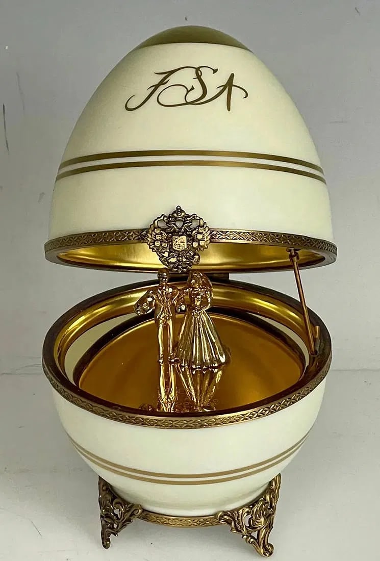 A LARGE IMPERIAL FABERGE LIMOGES PORCELAIN AND STERLING SILVER EGG: Circa 1980. Measures 8 inches high. Marked 925 Sterling , and Limoges porcelain. In good condition.Estimate $800-1.000