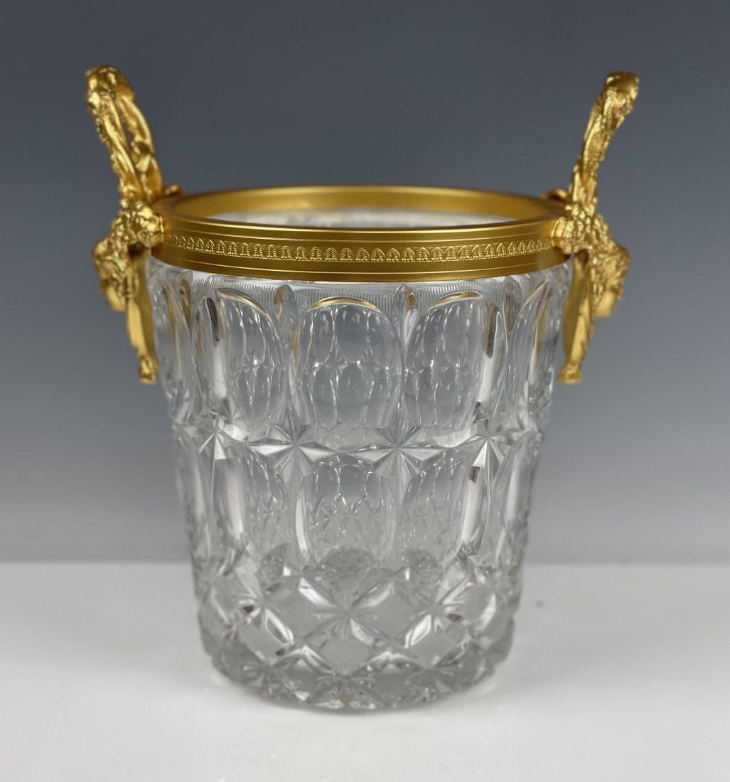 A LARGE ORMOLU MOUNTED BACCARAT STYLE ICE BUCKET: Measures 11 inches tall , 8 inches diameter. In excellent condition. Estimate $1.500-2.000