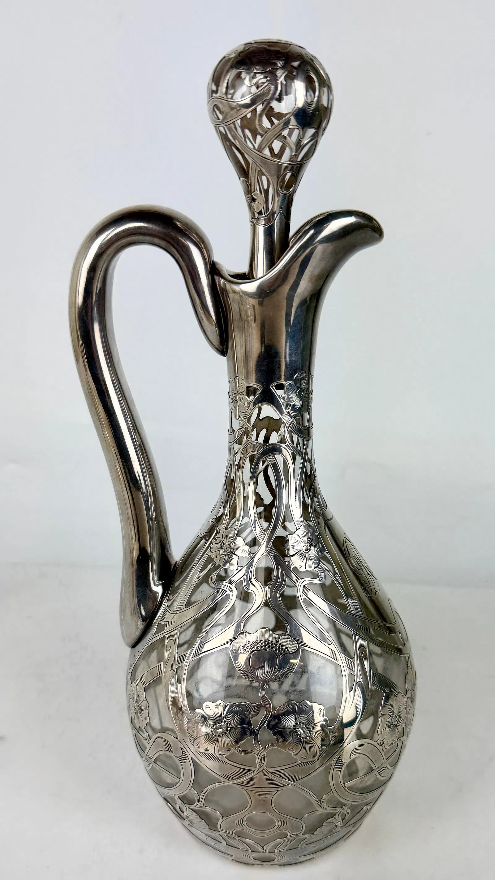 LARGE SILVER COVERED GLASS EWER: Circa 1920. Measures 12 inches h. In excellent condition. Estimate $600-800