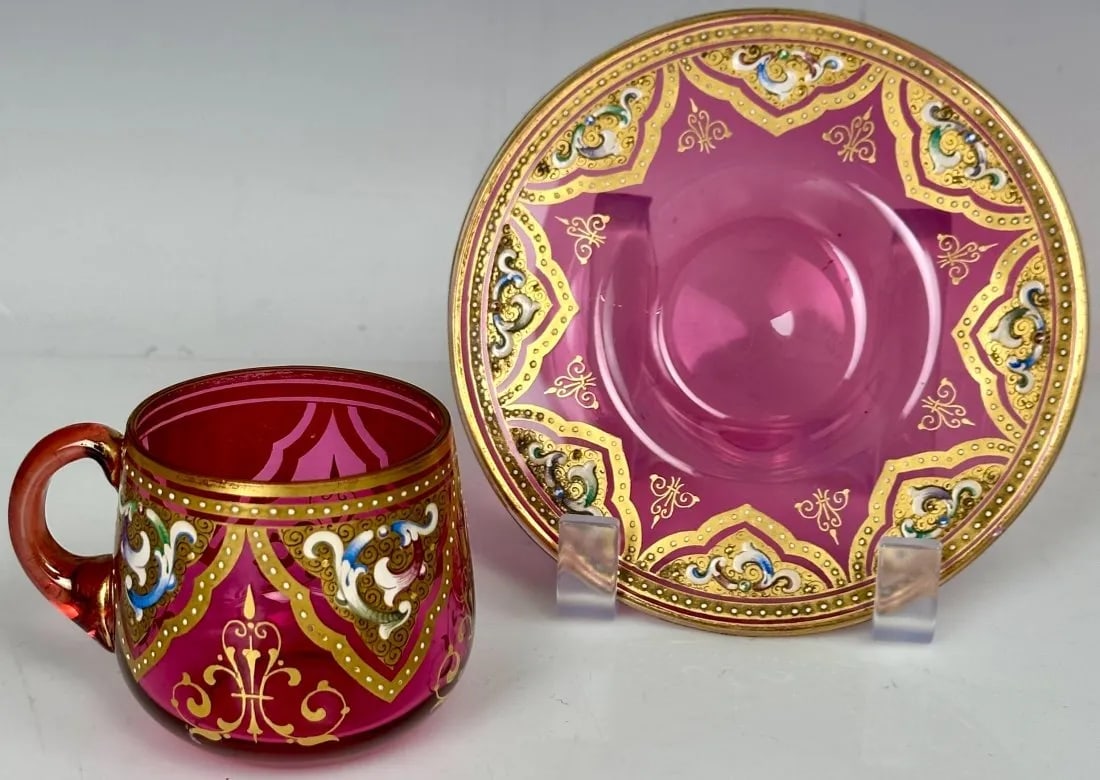 MOSER ENAMELLED AND GILT CUP AND SAUCER: Circa 1900. Saucer measures 6 inches; d. In good antique condition. Minor gilt loss. Estimate $400-500