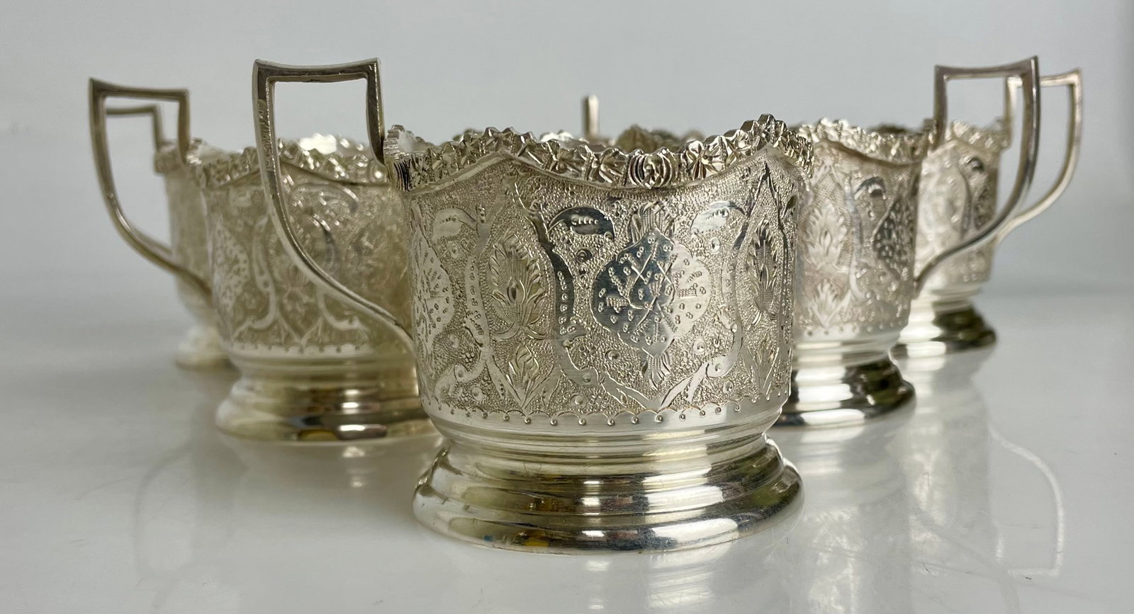 SET OF 6 IRANIAN SILVER GLASS HOLDERS: Circa 1960. Marked 84 and makers name. Weigh 656 grom, approx 22ox in good condition.Estimate $1200-1500