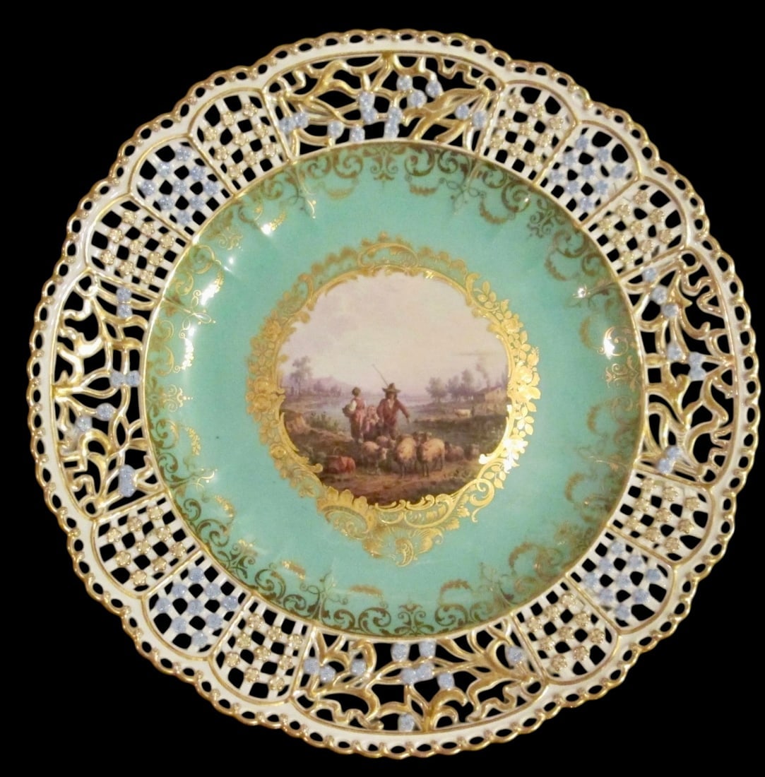 19TH C. RETICULATED MEISSEN PLATE: First quality cross swords mark measures 10.5 inches d. In excellent condition. Estimate $2000-2500