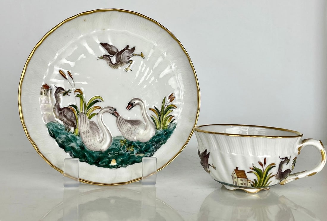 19TH CONTINENTAL PORCELAIN SWAN PATTERN CUP AND SAUCER: Saucer measures 5.5 inches d. In excellent condition. Estimate $500-600