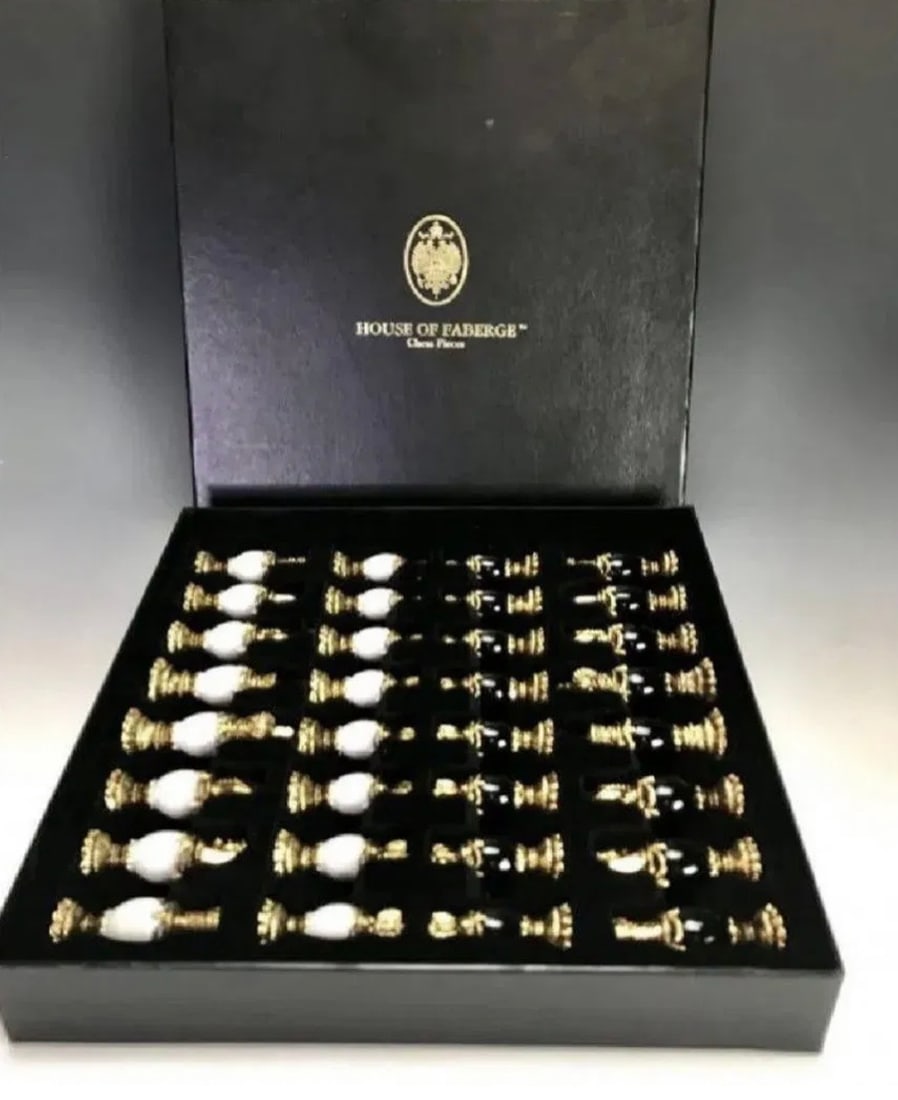 IMPERIAL FABERGE CHESS SET: This chess set with 24k gold plated headpieces, inspired by the jeweled eggs of Faberge produced by the Franklin Mint and designed by The House of Faberge . Estimate $3.000-4.000