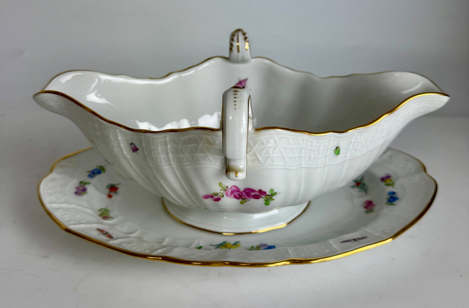 MEISSEN SAUCEBOAT: Circa 1900. Measures 8.5” l. In mint condition. Estimate $800-1000