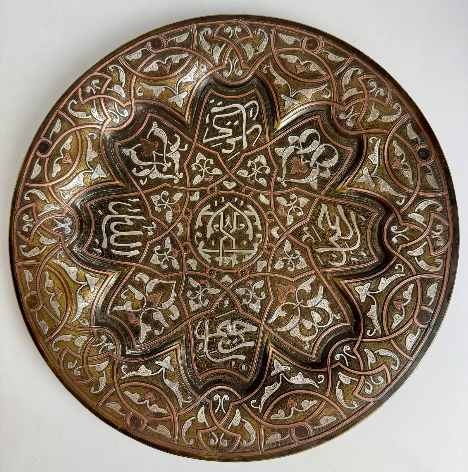 LARGE ISLAMIC SILVER INLAID DISH: Circa 1900. Measures 12”. In good condition. Estimate $10000-1200