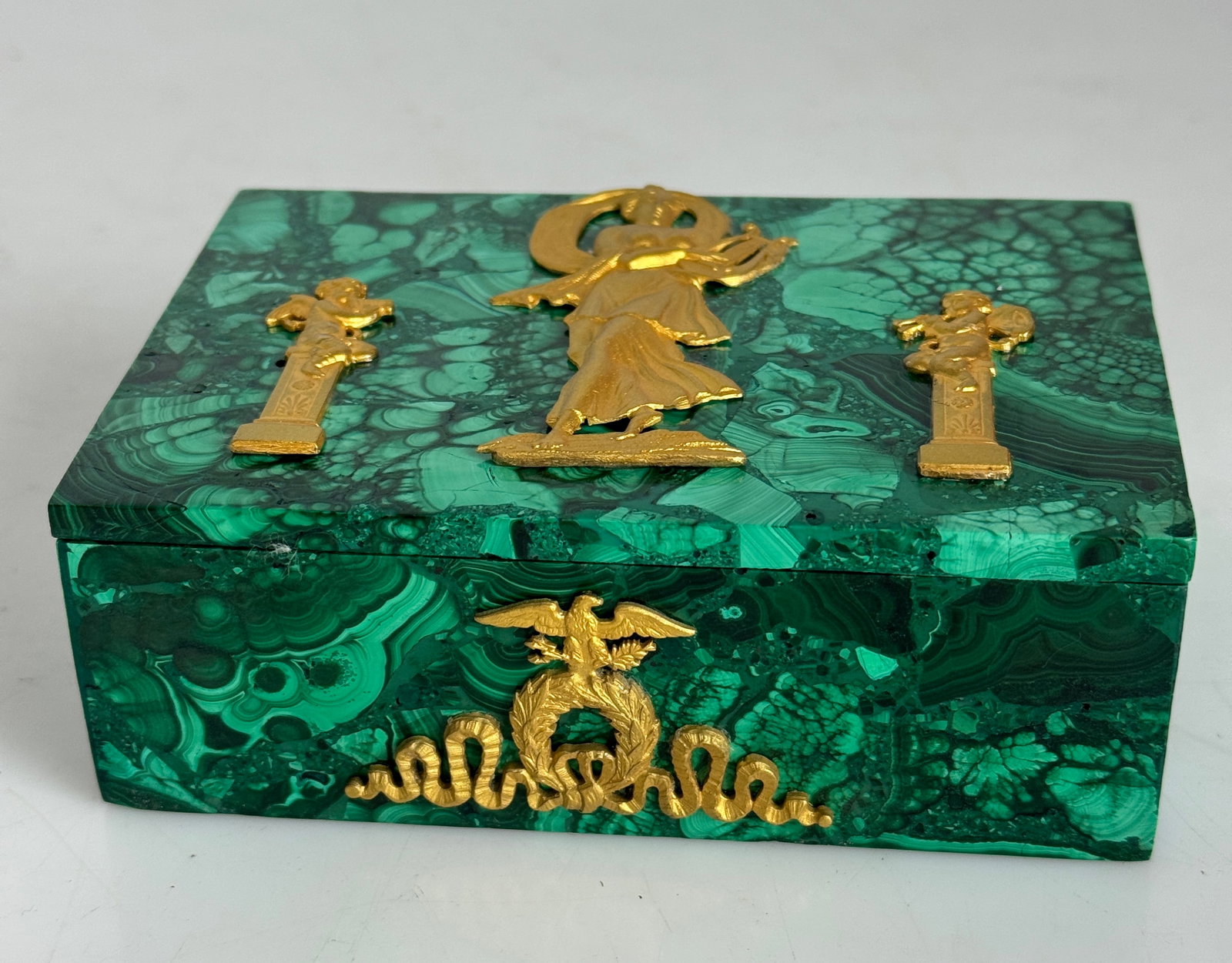 EMPIRE STYLE ORMOLU MOUNTED MALACHITE JEWLRY BOX: Measures 5”x4”x3”. . In very good condition. Estimate $500-600