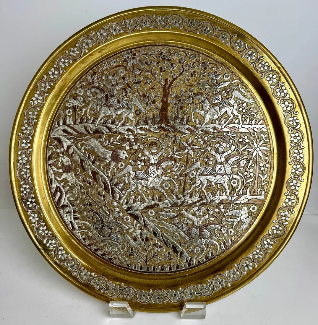 A MAGNIFICENT ISLAMIC SILVER AND COPPER INLAID TRAY: Circa 1900. With Persian motives. Measures 17.5 inches D. In good condition. Estimate $2000-2500