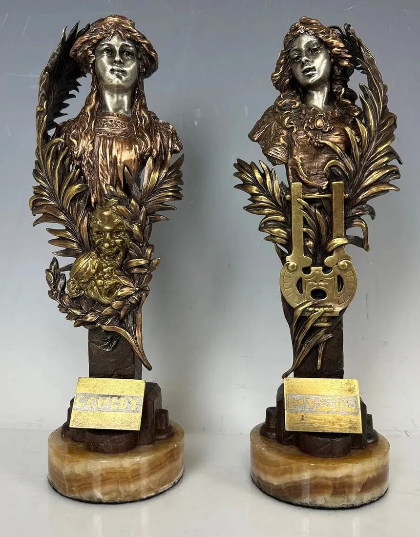 PAIR OF AUSTRIAN BRONZES SIGNED KAUBA: Carl Kauba (Austrian, 1865-1922) bronze figural female busts on pilaster pedestals with long leafy branches reaching upward, theater masks in front of one and a lyre in front of the other; titled on