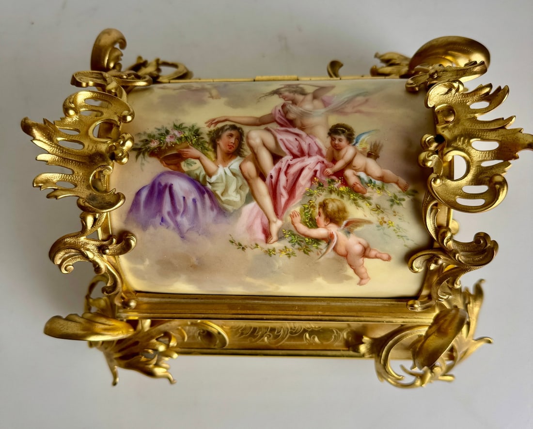 AN IMPOSING ORMOLU MOUNTED ROYAL VIENNA JEWLRY BOX: Circa 1900. Measures 12 inches .l. In excellent condition. Estimate $4000-5000