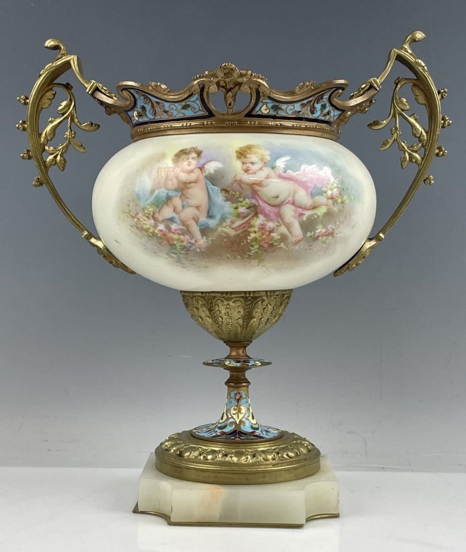 19TH C. FRENCH CHAMPLEVE ENAMEL & SEVRES CENTERPIECE: Measures 10 inches tall. In good condition. Estimate $1.200-1.500