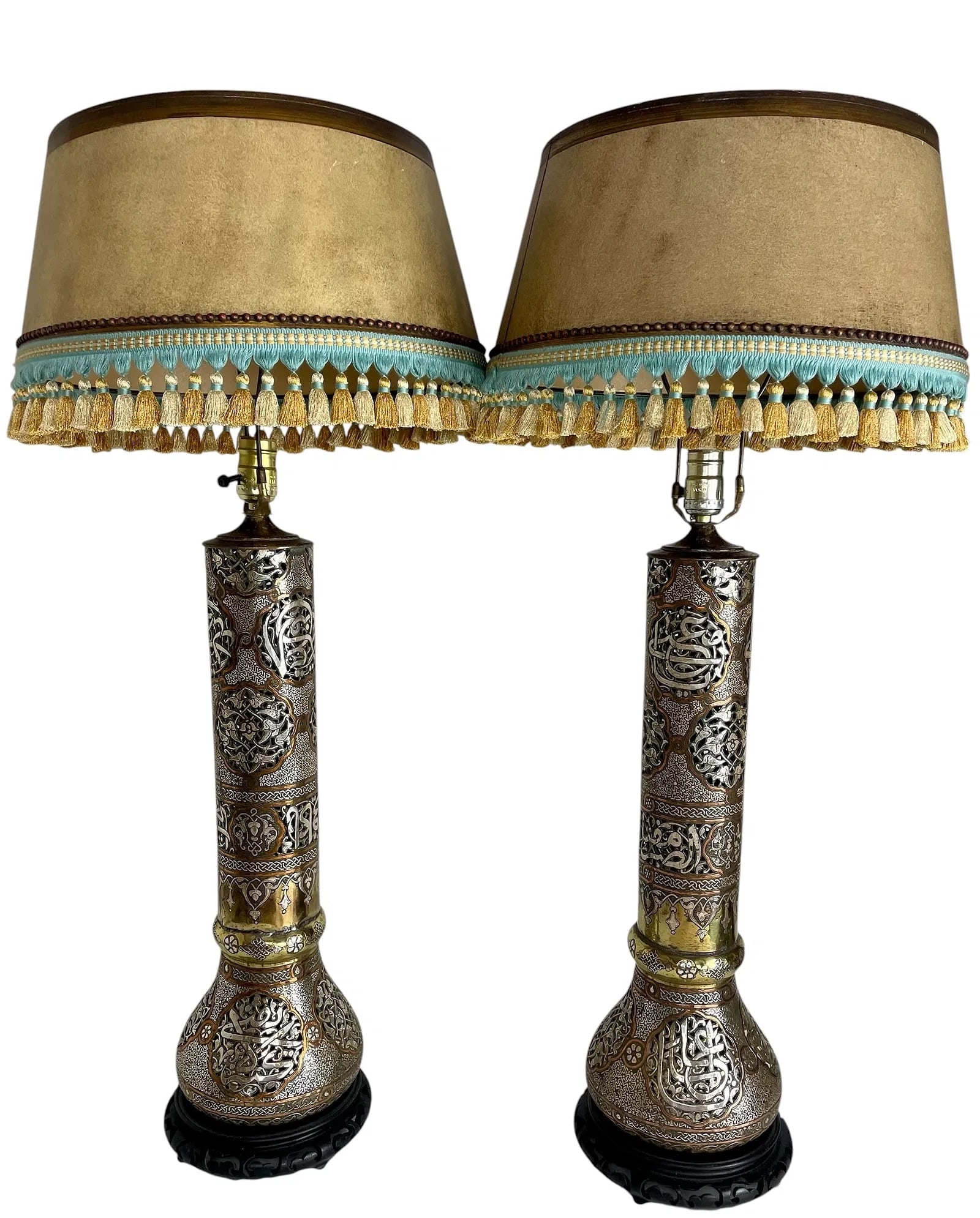 A VERY LARGE PAIR OF ISLAMIC SILVER INLAID LAMPS: Circa 1900. Measure 32 inches overall high. Estimate $4000-5000