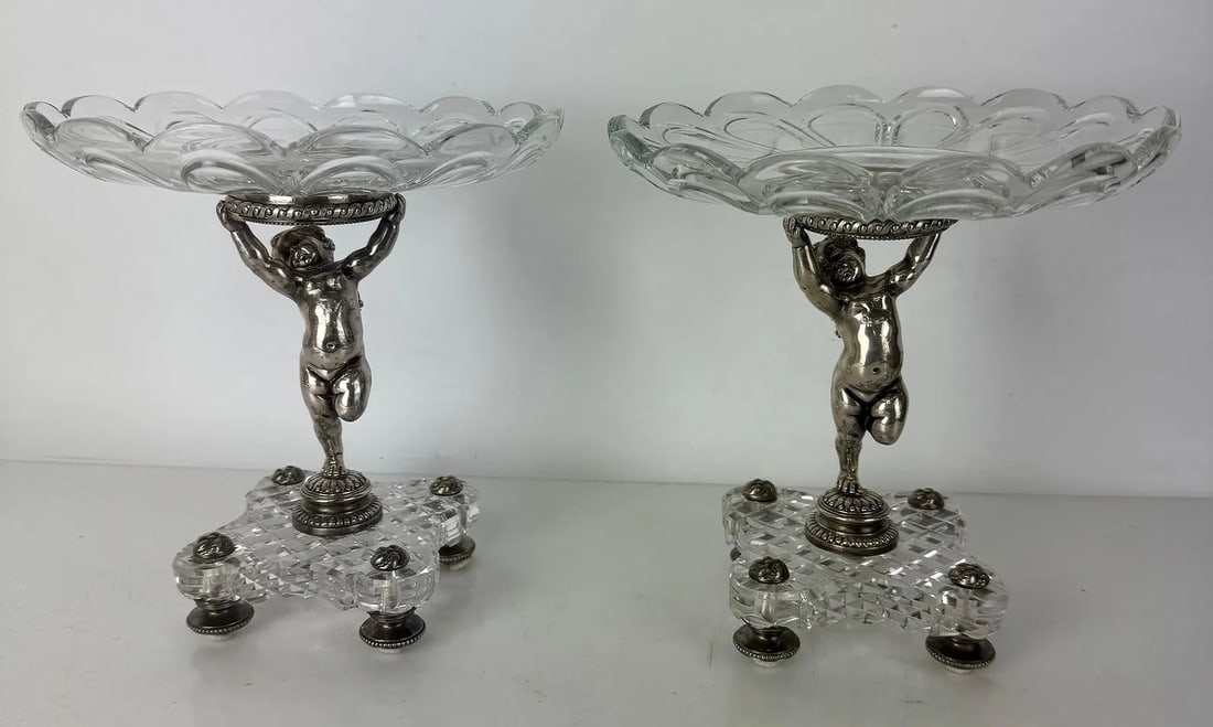 A PAIR OF SIGNED BACCARAT AND SILVERED BRONZE TAZZAS: Circa 1900. Measure 9 inches d., 8.5 inches h. In excellent condition. Estimate $2500-3000