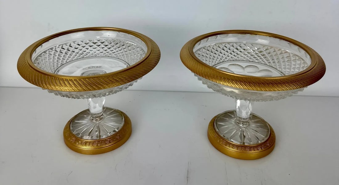 A PAIR OF ORMOLU MOUNTED AND BACCARAT STYLE CRYSTAL TAZZAS: Circa 1900. Measure 6.5 inches d. In excellent condition. Estimate $1200-1500