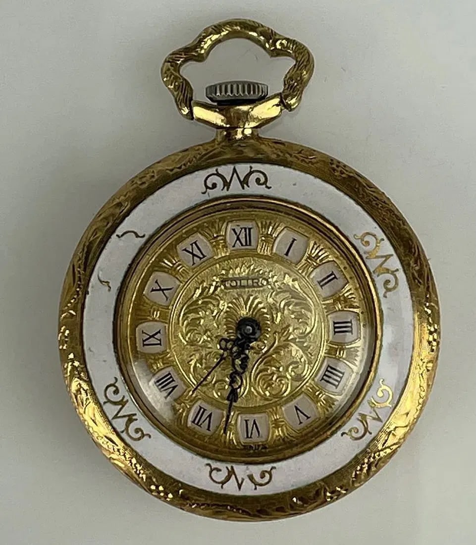 SWISS GOLD AND ANAMEL POCKET WATCH: Stamped Toliro Swiss. Movement not tested. Estimate $1.000-1.200