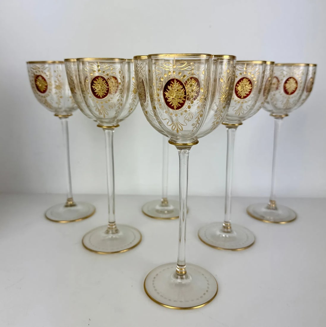 SET OF 6 LARGE MOSER GILT WINE GLASSES: Circa 1900. Measure 7.75 inches tall. In excellent condition, minor loss of gold. Estimate $1000-1200