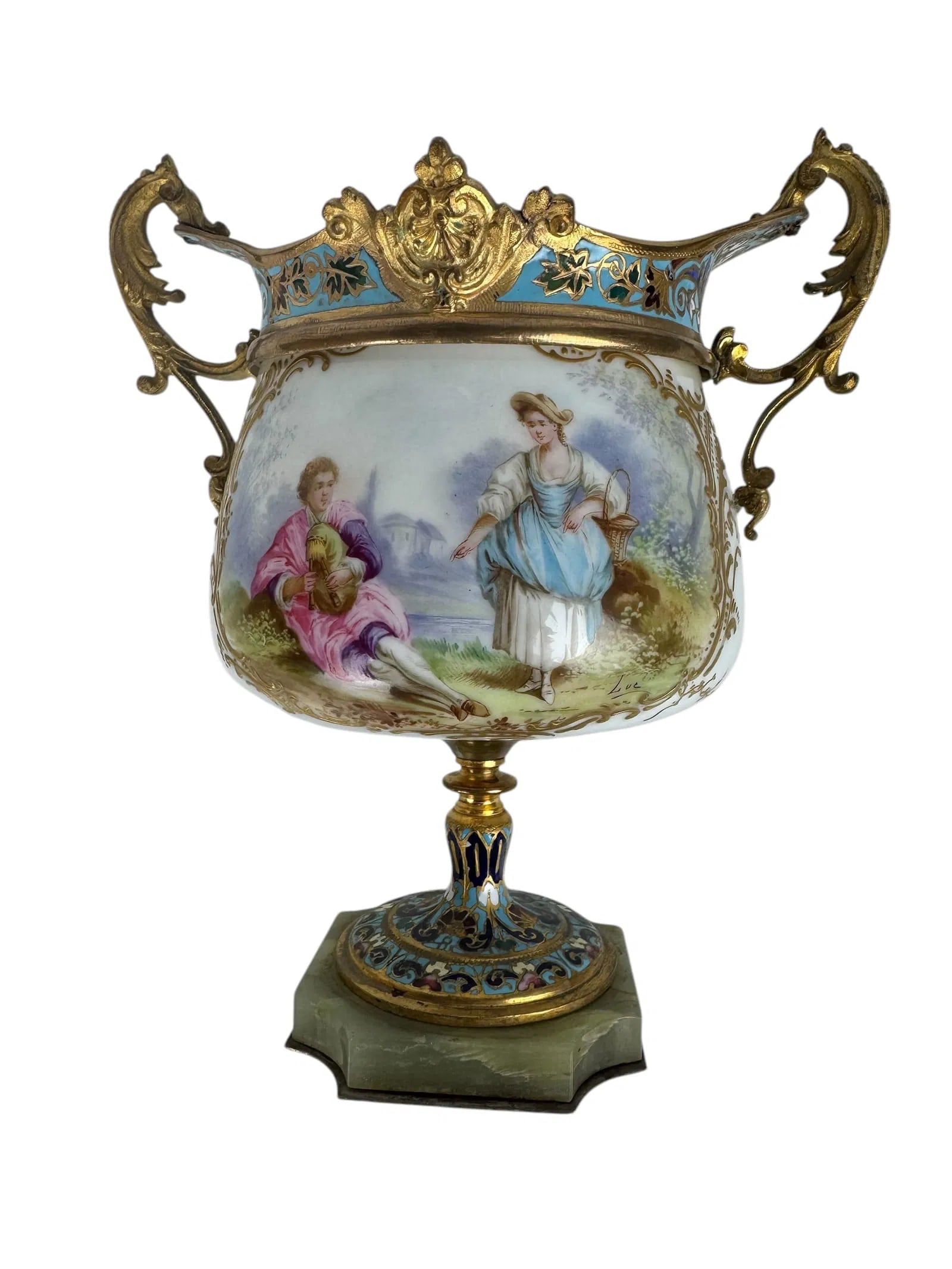 FRENCH SEVRES AND CHAMPLEVE ENAMEL CENTREPIECE: Circa 1900. Measures 8 inches high. In good condition, no breaks, no restoration.Estimate $1200-1500