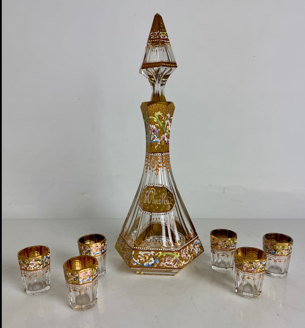 19TH C. ENAMELED MOSER LIQUOR SET: Comprising of a liquor bottle, 10 inches tall, and 6 shot glasses. All in excellent condition.Estimate $800-1000