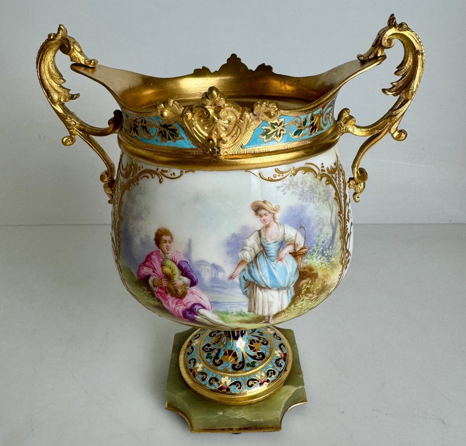 CHAMPLEVE ENAMEL AND SEVRES VASE: Circa 1900. Measures 7.5” h. In excellent condition. Estimate $1000-1200