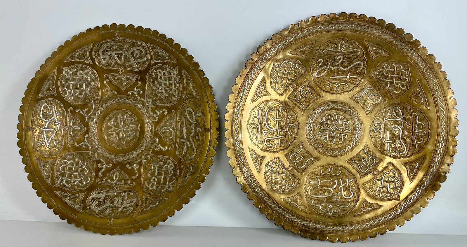 A PAIR OF ISLAMIC SILVER INLAID CHARGERS (1 of 3)