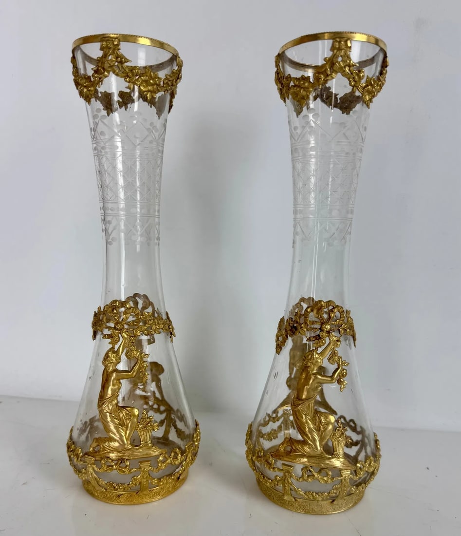 A PAIR OF EMPIRE STYLE ORMOLU MOUNTED BACCARAT VASES: Circa 1900. Measure 10 inches tall. In excellent condition. Estimate $1200-1500