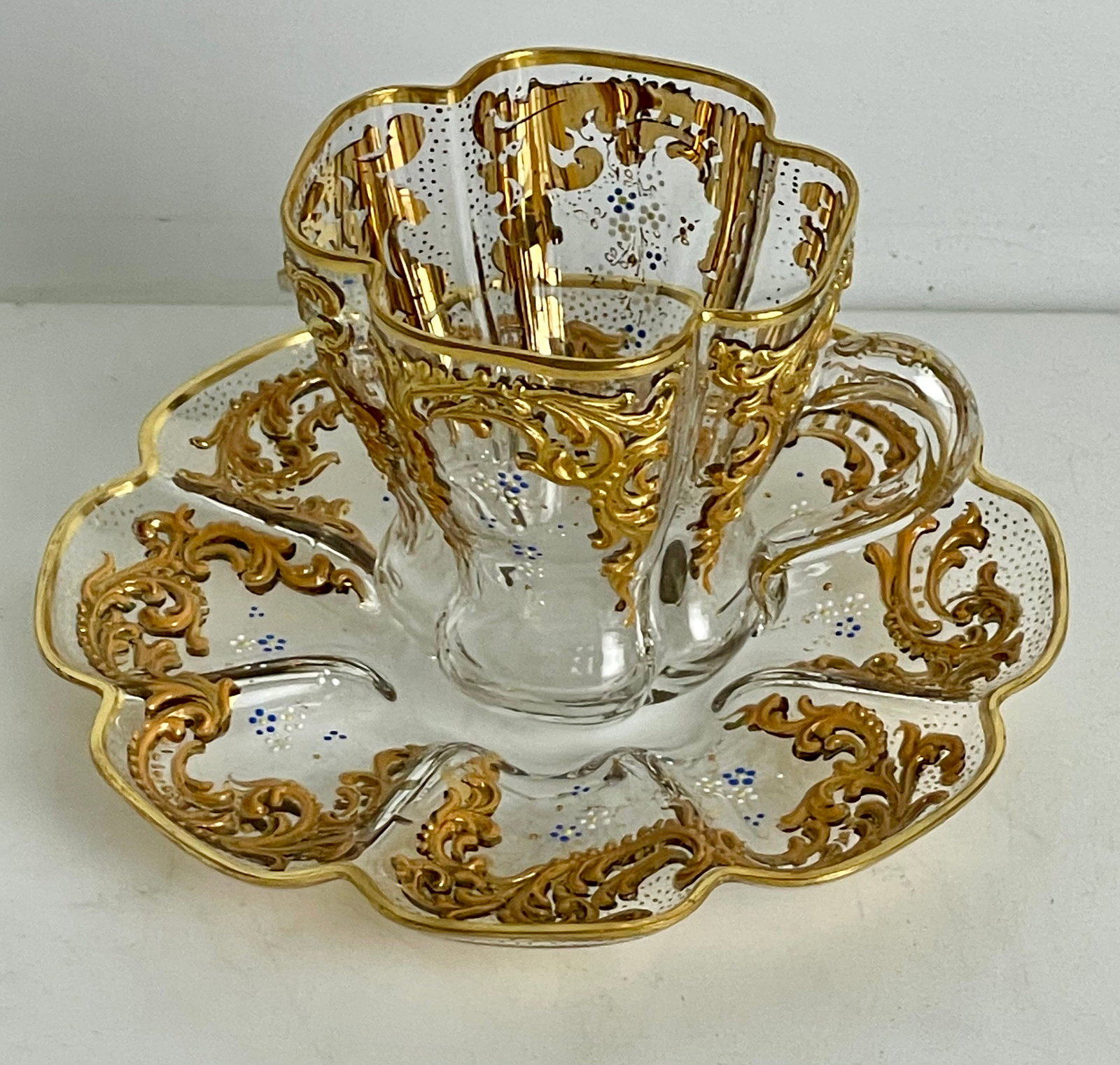 19TH C. ENAMELLED AND GILT MOSER CUP AND SAUCER: Saucer 5.5”. In excellent condition. Estimate $400-500