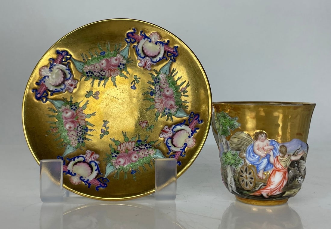 19TH C. CAPODIMONTE DEMITASSE CUP AND SAUCER: In good condition. Minor age related scratches. Estimate $400-500