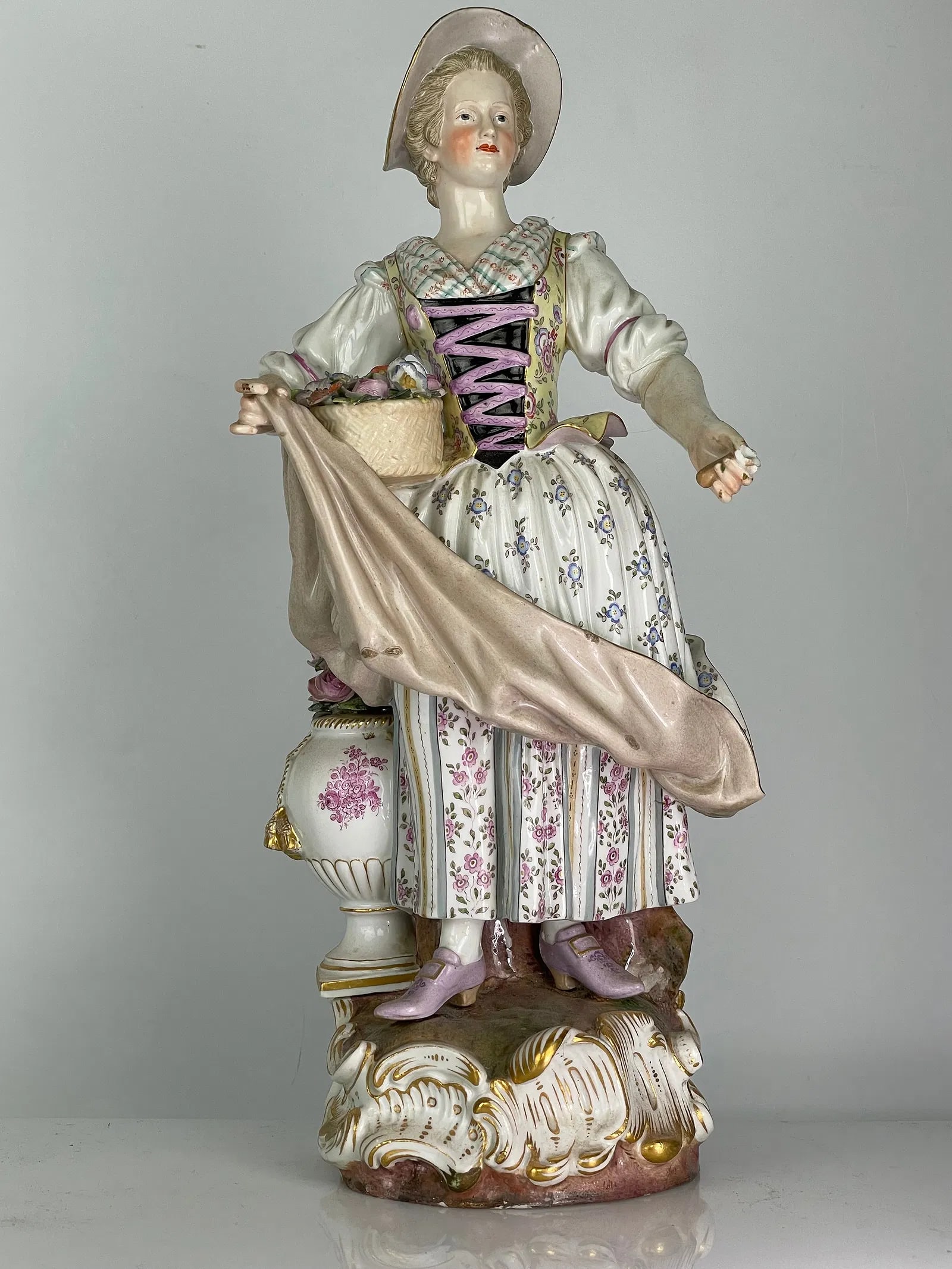 A LARGE MEISSEN FIGURE: Circa 1880. First quality cross swords mark. Measures 14 inches high. In overall very good condition, one finger broken. Estimate $800-1000