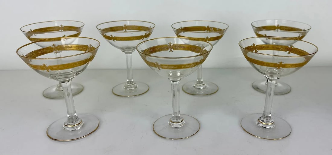 SET OF 7 MOSER STYLE GILT CHAMPAGNE GLASSES: Measure 6.5 inches h. In good condition. Estimate $300-500