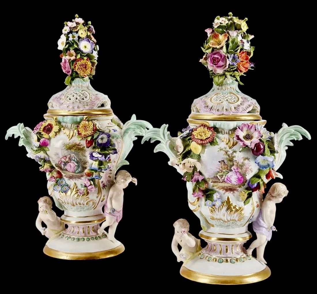 A PAIR OF MEISSEN VASES: Circa 1900. Painted with Watteau scenes. Measure 14 inches tall. In good condition. Estimate $2500-3000