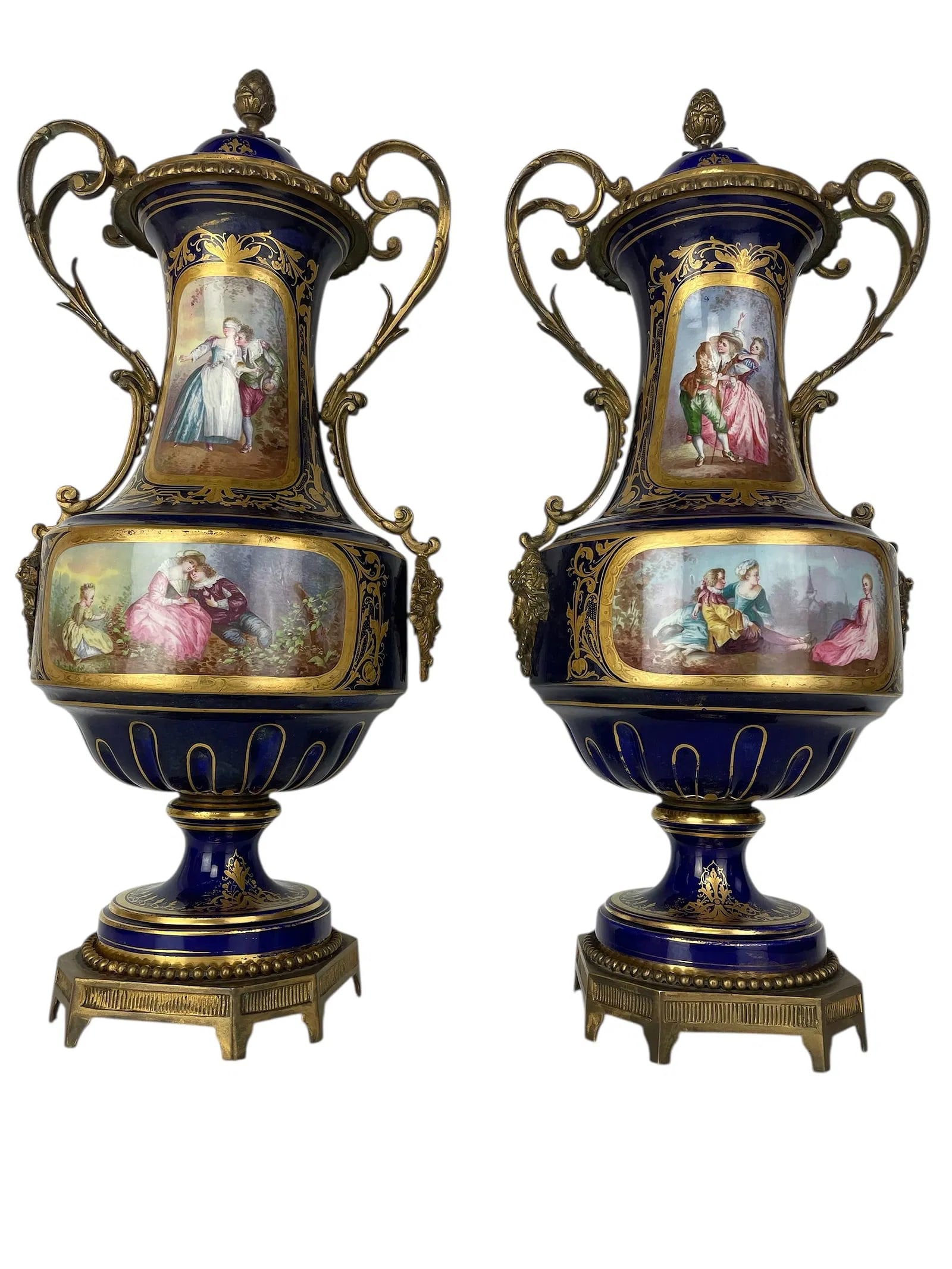 A PAIR OF ORMOLU MOUNTED SEVRES PORCELAIN VASES AND COVERS: Circa 1900. Measure 17.5 inches Tall. No breaks, no chips. Estimate $2500-3000