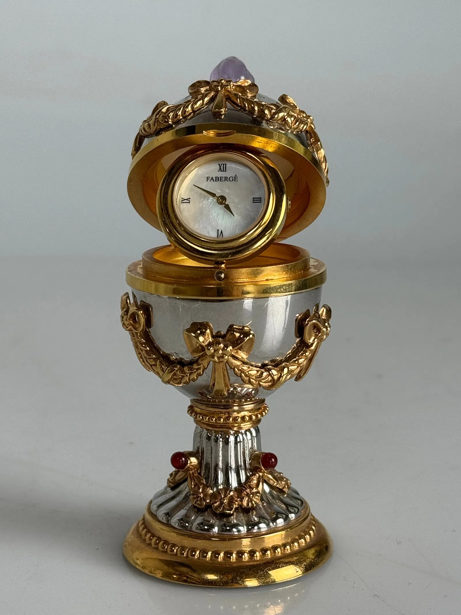 IMPERIAL FABERGE CLOCK EGG: Measures 4 inches h. Estimate $800-1000