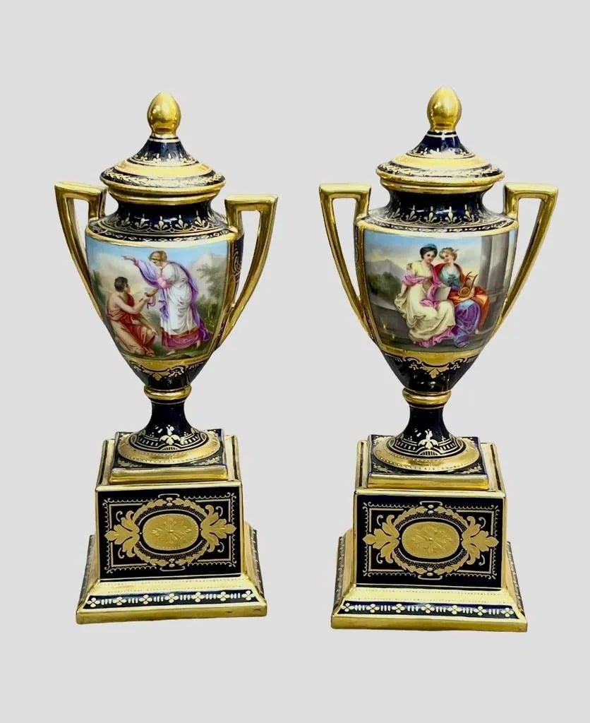 A PAIR OF ROYAL VIENNA STYLE VASES AND COVERS: Circa 1900. . Measure 10 inches high. In good antique condition. Estimate $1.000-1.200