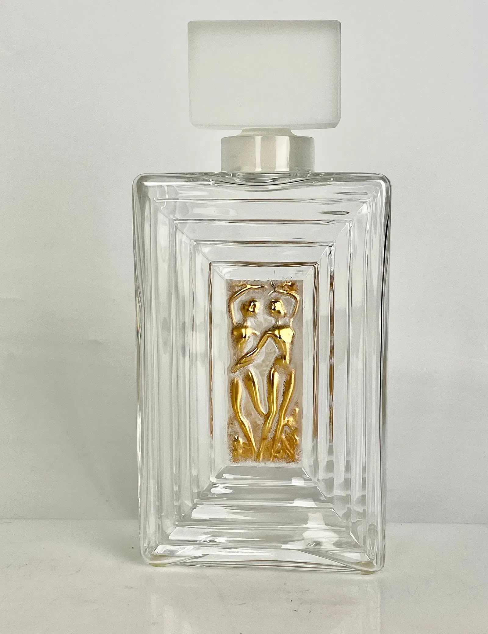 LALIQUE PERFUME BOTTLE: Signed Lalique France. Measures 9 inches high. In excellent condition. Estimate $600-800