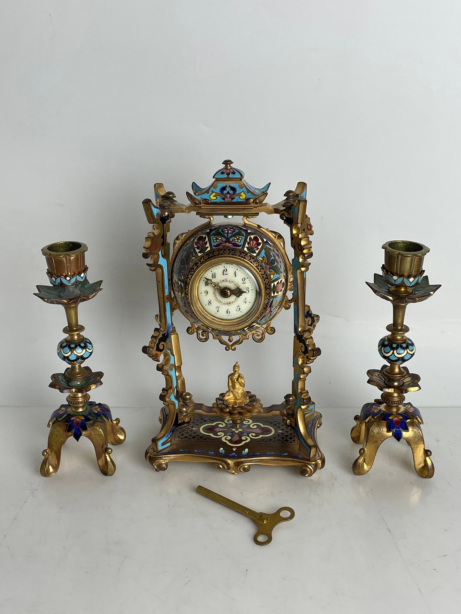 FRENCH CHINOISERIE CHAMPLEVE ENAMEL CLOCK GARNITURE: Circa 1900. Clock measures 8.5” h. Estimate $1000-1200