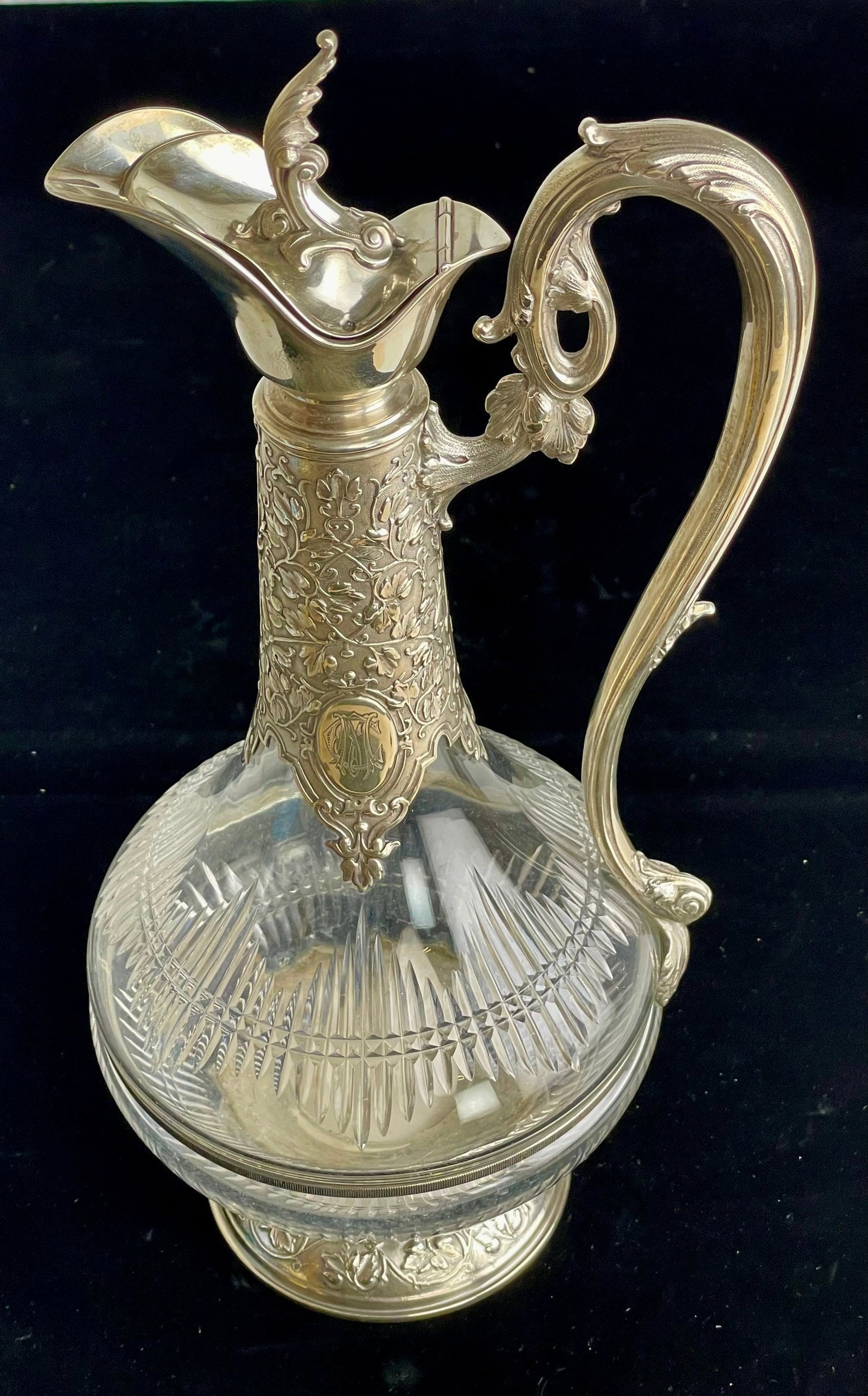 19TH C. CONTINTAL SILVER AND CUT GLASS LIQUOR BOTTLE: Measures 14” h. In excellent condition. Estimate $1500-2000