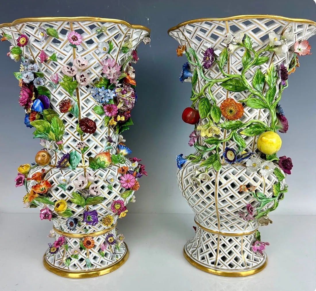 A LARGE PAIR OF 19TH C. FLOWER ENCRUSTED RETICULATED MEISSEN VASES: Circa 1880. Measure 16 inches high. Estimate $15.000-20.000