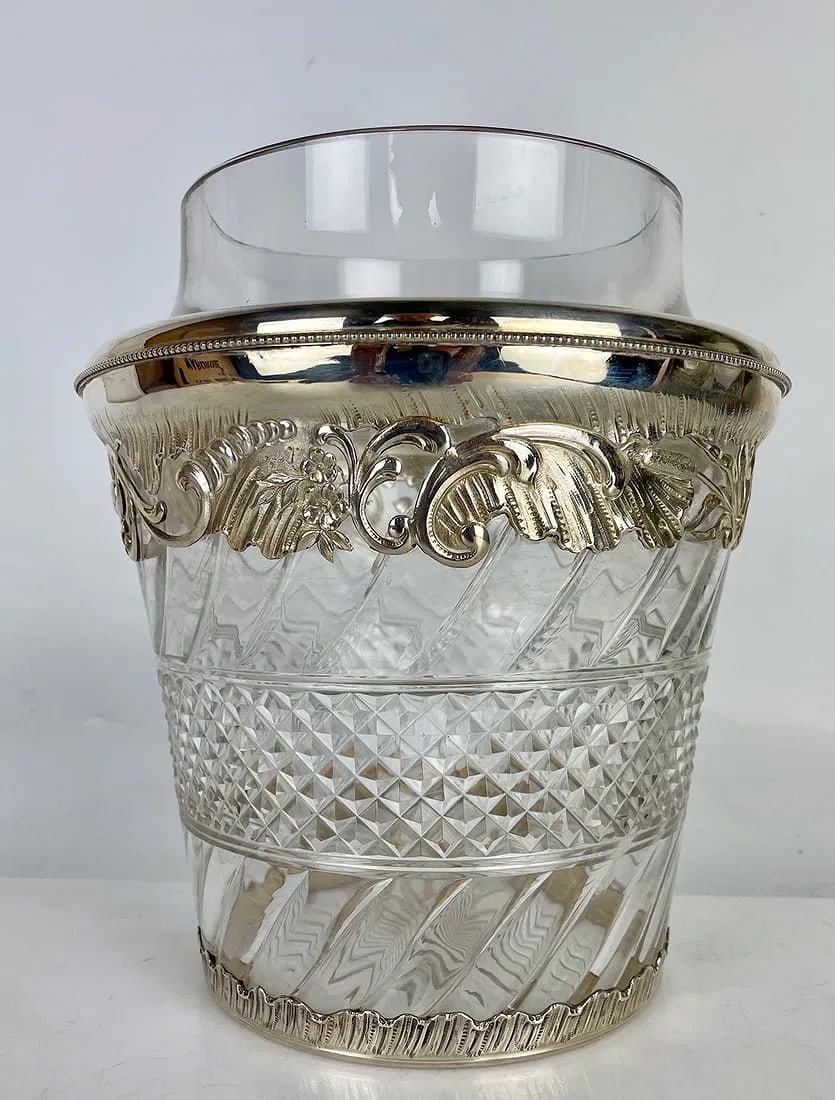CONTINENTAL SILVER AND CUT CRYSTAL CHAMPAGNE BUCKET: Circa 1900. Silver hall marks. Measures 12 inches high. In excellent condition. Estimate $2000-2500