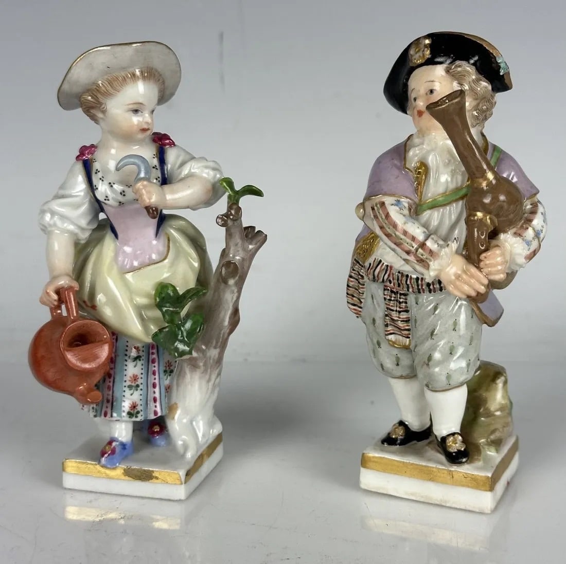 A PAIR OF 19TH C. MEISSEN FIGURES: First quality cross swords marks. Measure 4 inches high. In good condition. Estimate $800-1.000