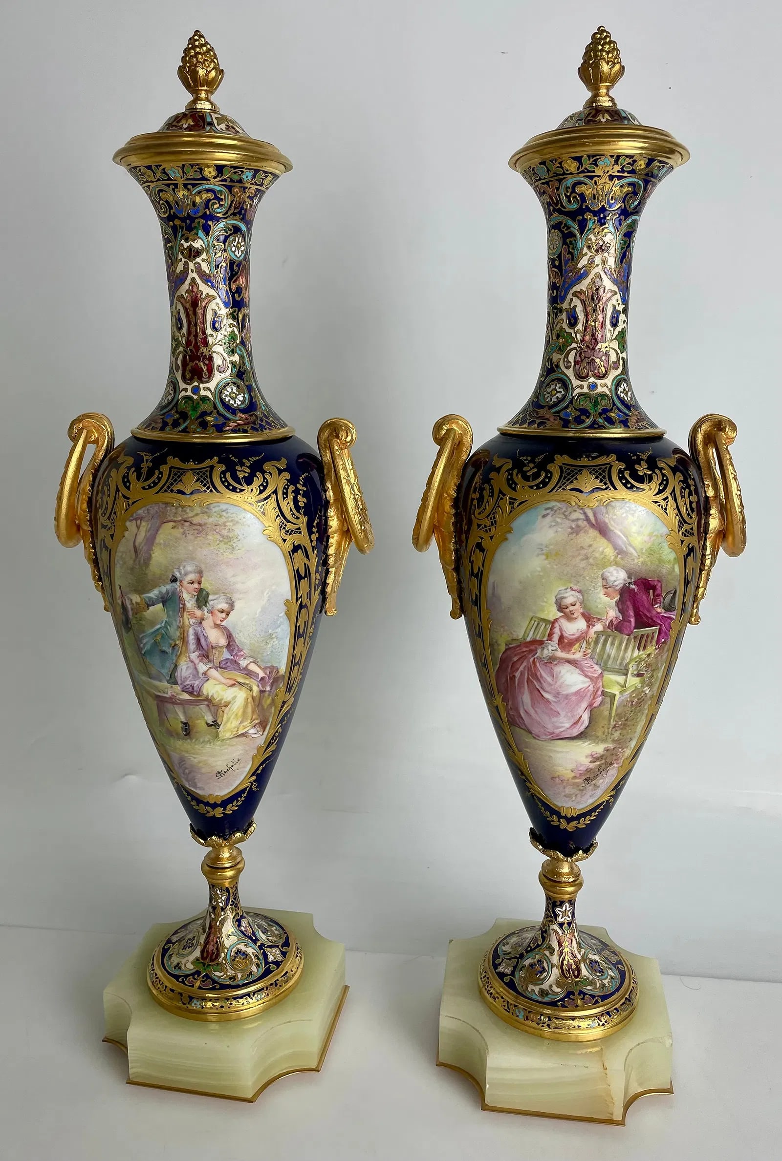 A LARGE PAIR OF CHAMPLEVE ENAMEL SEVRES PORCELAIN VASES: Circa 1900. Measures 18.5 inches high. Estimate $2000-2500