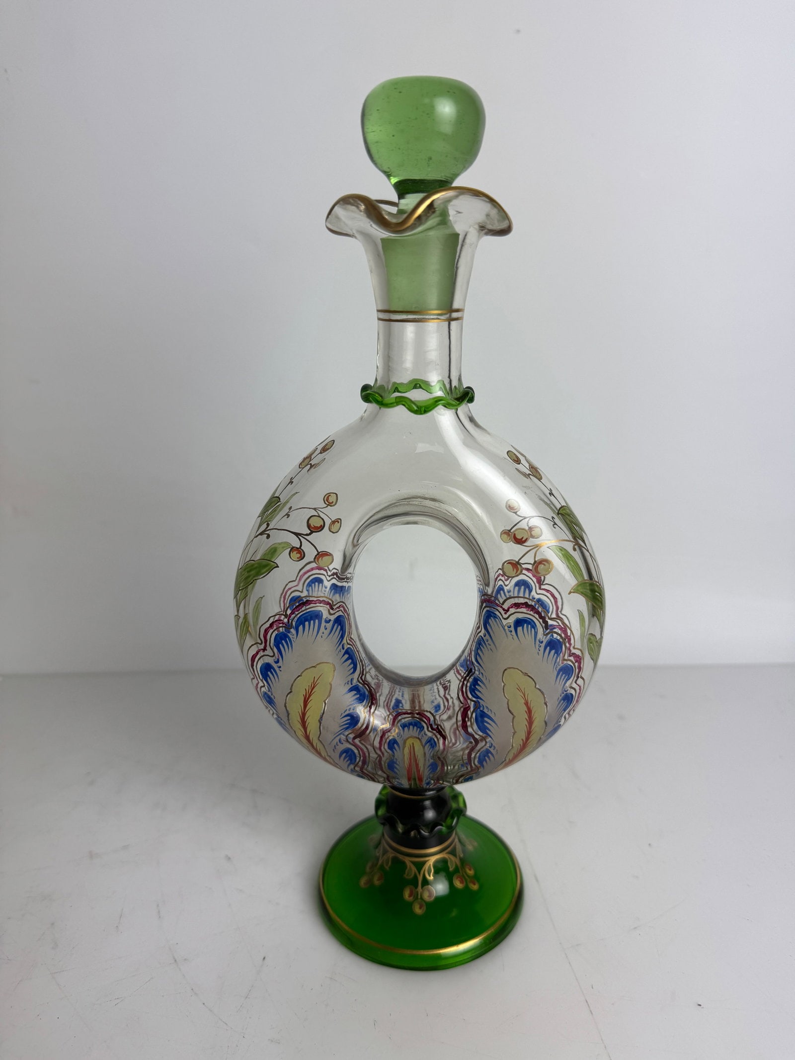 ART NOUVEAU MOSER STYLE ENAMELLED LIQUOR BOTTLE AND STOPPER: Circa 1920. Measures 10” high. In very good condition. Estimate $600-800
