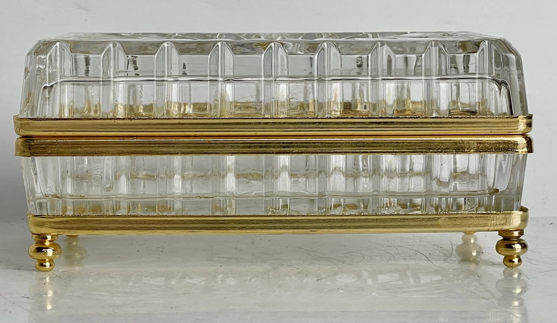 ORMOLU MOUNTED CRYSTAL BOX: Measures 5.5”x3.5” x 3”. In excellent condition. Estimate $250-300