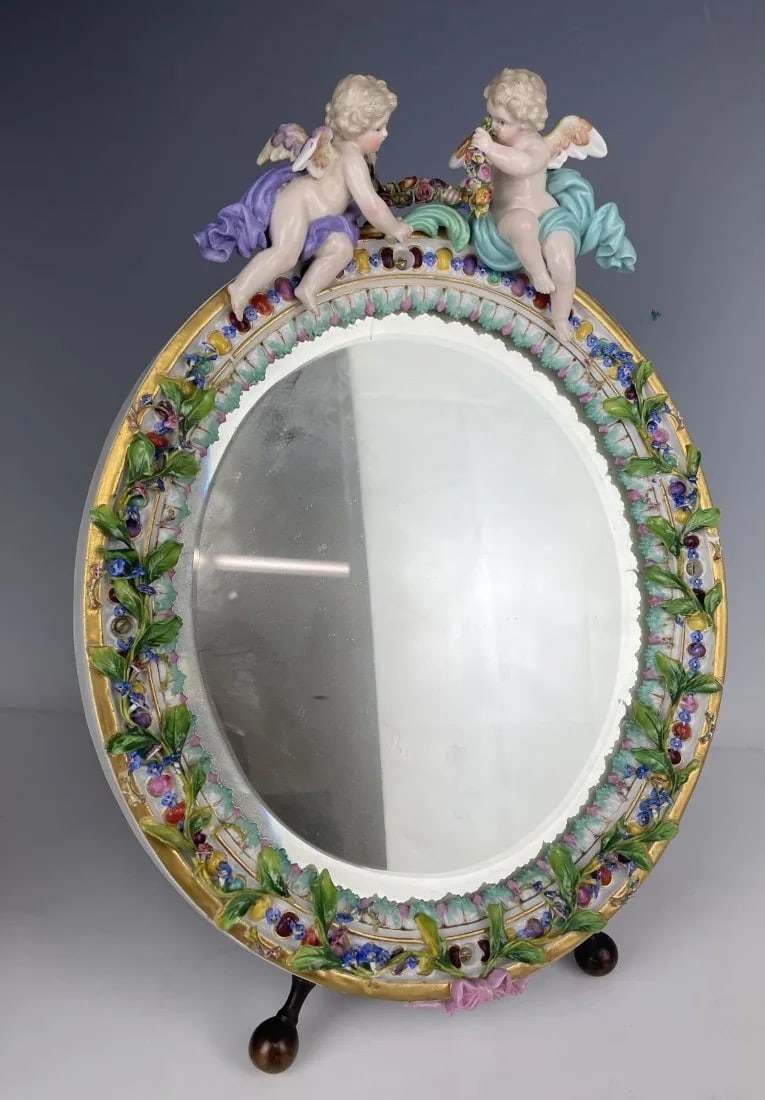19TH C. FLOWER ENCRUSTED MEISSEN MIRROR: First quality cross swords mark. Measures 13 inches tall. In good antique condition.Estimate $1.500-2.000