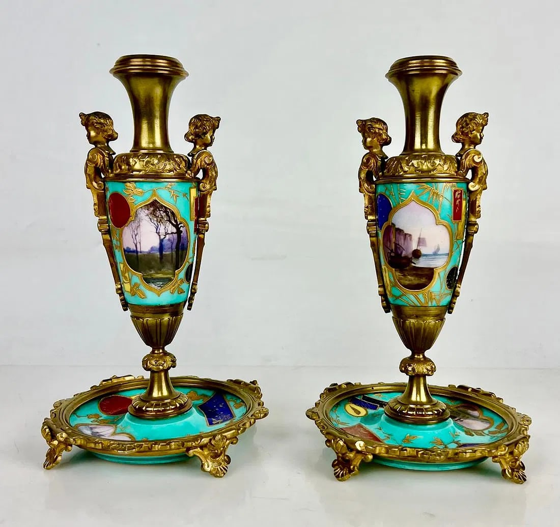 A PAIR OF ORMOLU MOUNTED PARIS PORCELAIN VASES: Circa 1900. Measures 9 inches h. In excellent condition. Estimate $2000-2500