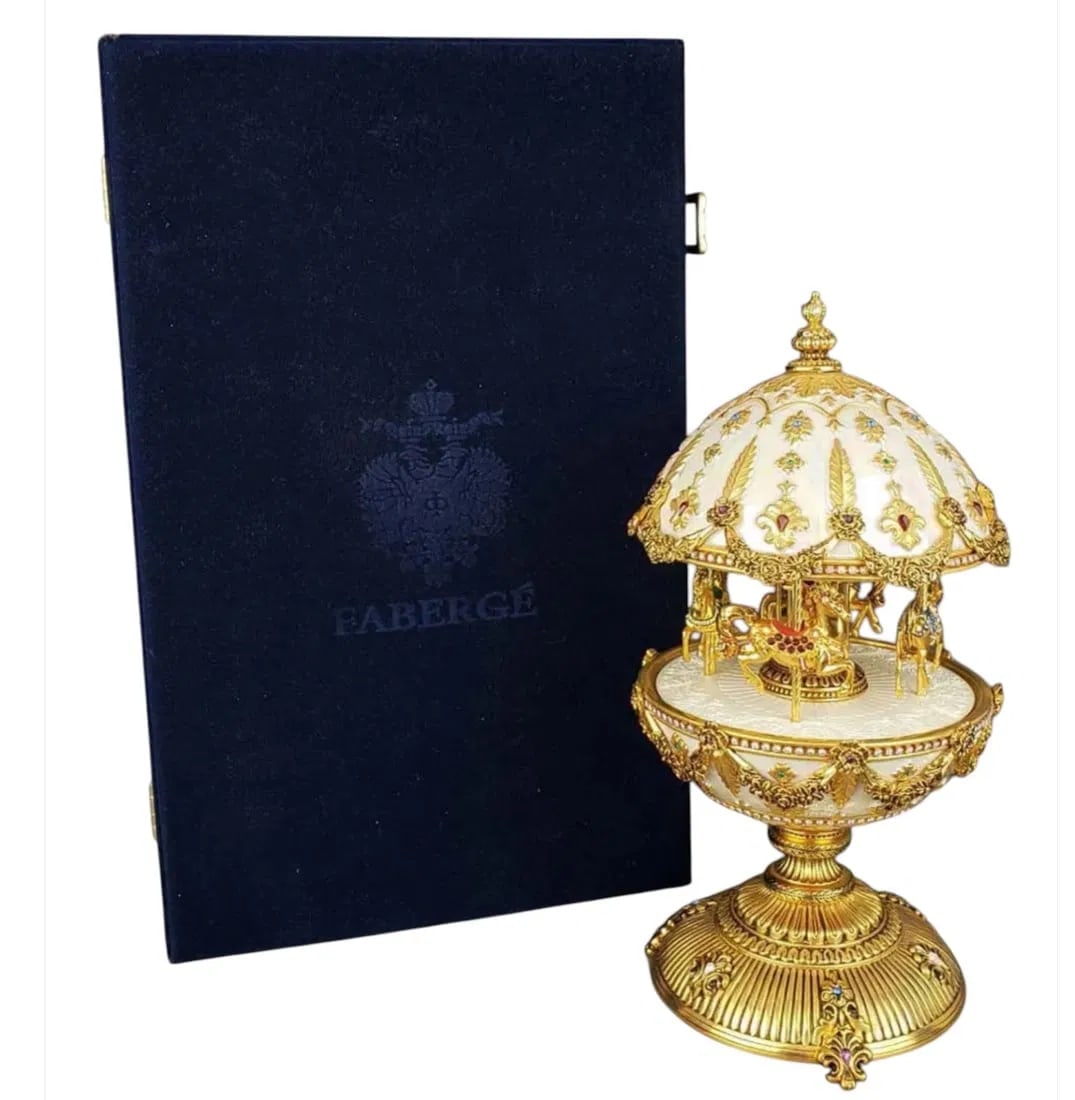 IMPERIAL FABERGE MUSICAL CARROUSEL: Inlaid with stones. Plays music as it goes round. In good condition. Estimate $1500-2000