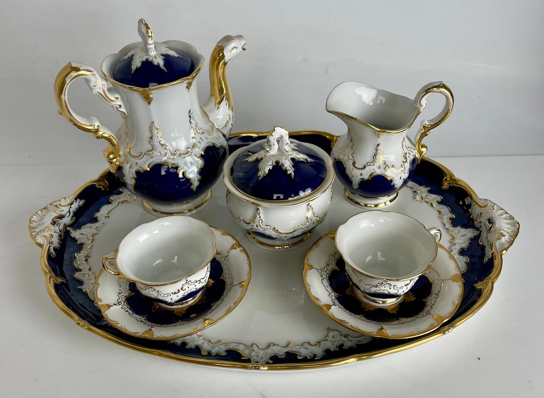ANTIQUE MEISSEN TETE A TETE: Circa 1920. Consisting of a tray, tea pot, creamer and sugar pot and 2 cups and saucers. Estimate $2500-3000