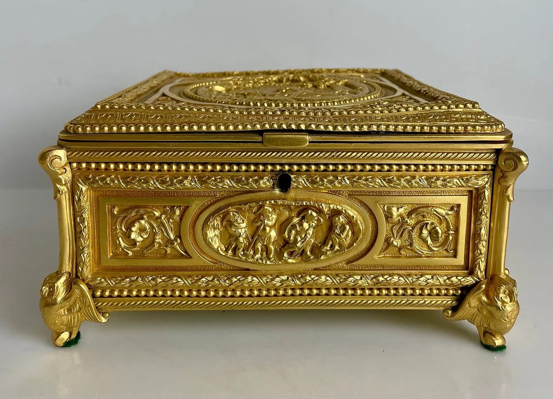 ANTIQUE ORMOLU CASKET BOX: Circa 1900. Measures 7.5 inches x 7.5 inches x4 inches h. In good used condition. Estimate $1200-1500.