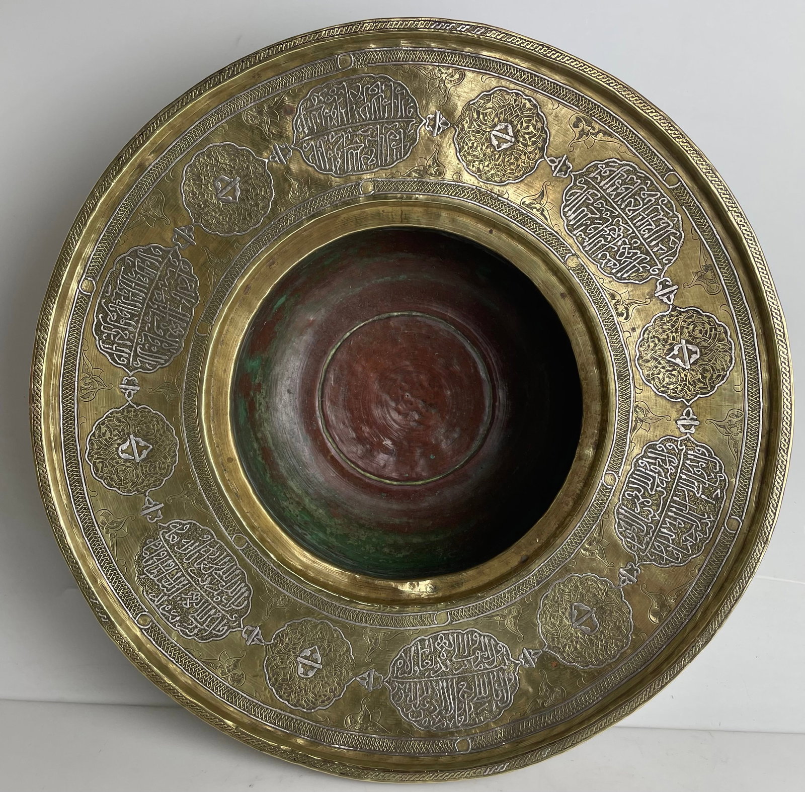 A LARGE ISLAMIC SILVER INLAID BASIN: Circa 1900. Measures 16” D, 6” h. Estimate$2500-3000
