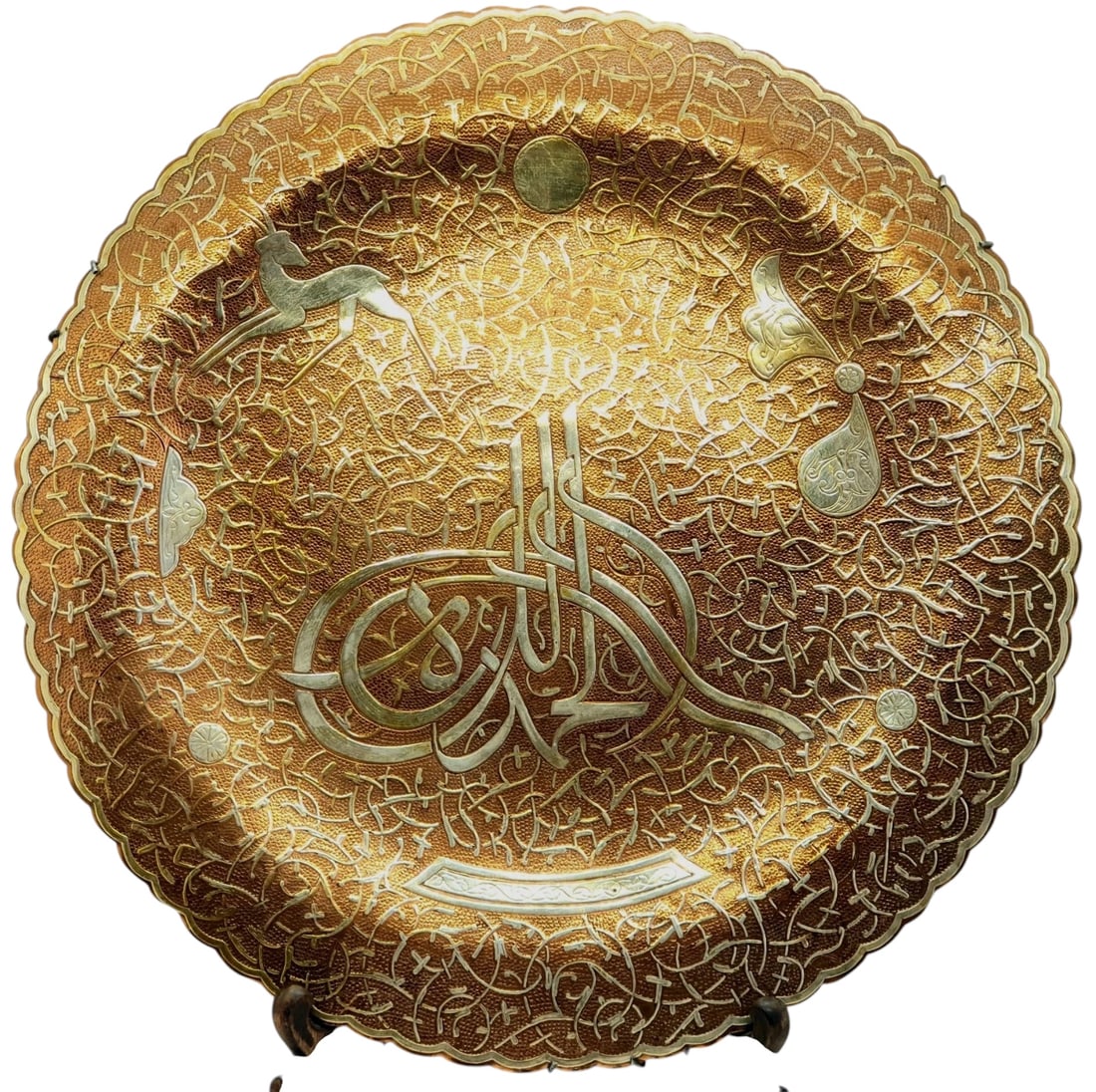 ISLAMIC SILVER INLAID PLATTER: Circa 1920. Measures 13” d. Estimate $700-800