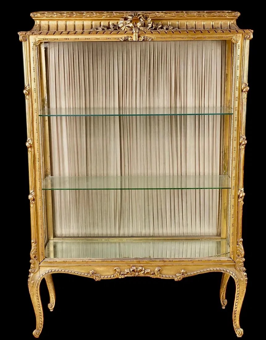LOUIS XV STYLE GILTWOOD VITRINE: Circa 1900. with two glass shelves 64 x 43 1/2 x 15 in. (162.6 x 110.5 x 38.1 cm.) Estimate $2500-3000